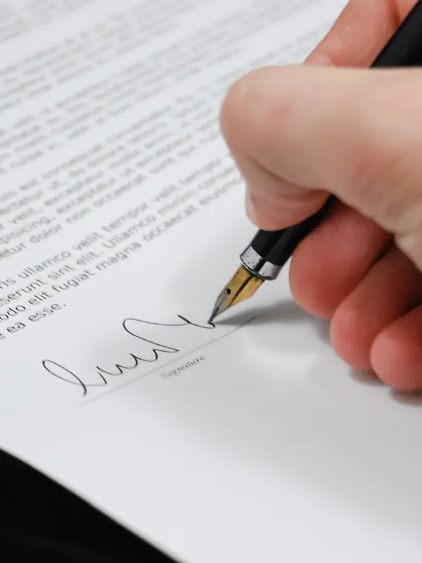 Image of a document being signed